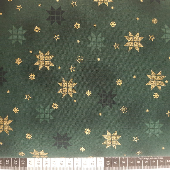 Patchwork stof, grøn bund med små guld stjerner, iskrystaller og patchwork julestjerner