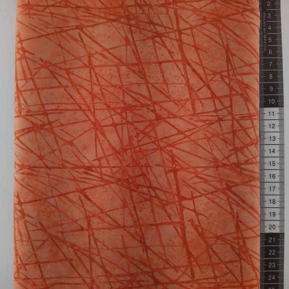 Patchwork stof, lakse farvet meleret bund med tilfældige placeret orange streger.
