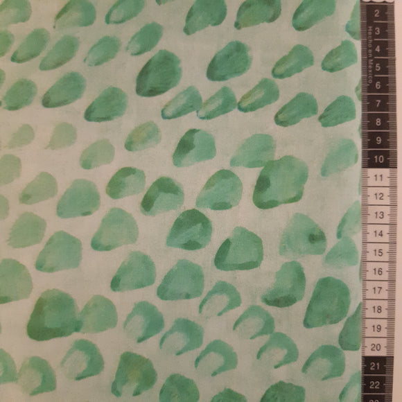 Patchwork stof, turkis grøn med mønster der ligner sten
