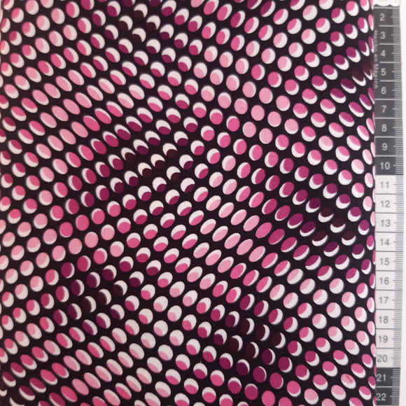 Patchwork stof, sort med pink/lilla ovaler der danner mønster.