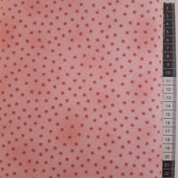 Patchwork stof, meleret lyserød med små prikker og stjerner.