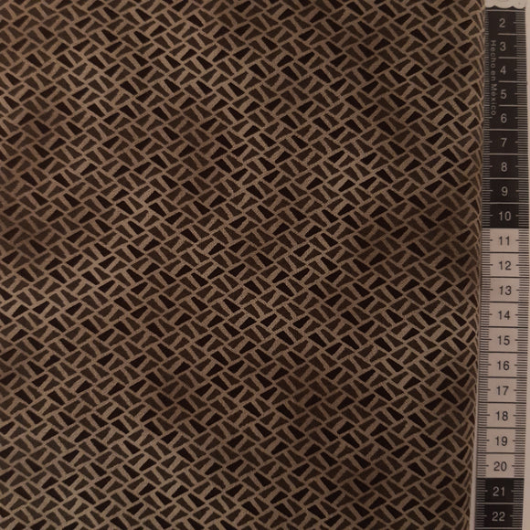 Patchwork stof,  brun og grå små skæve rektangler.