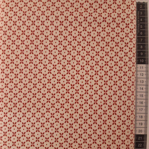 Patchwork stof, råhvid med røde mini prikker og ovaler som danner mønster.