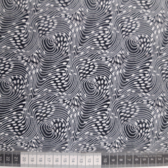 Patchwork stof, grå meleret med bølgende mønster.