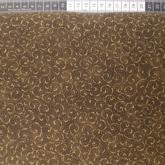 Patchwork stof, mørk oliven grøn med små svirvler.