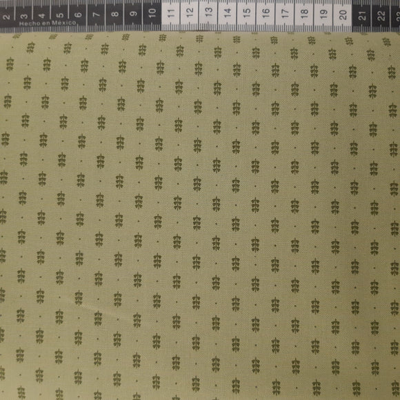 Patchwork stof, støvet lys grøn med små prikker og blade.