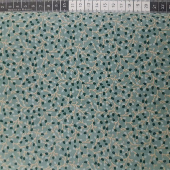 Patchwork stof, støvet turkis grøn med blad grene mønster.