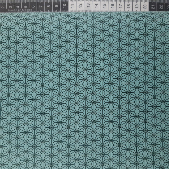 Patchwork stof, lys turkis blå med stjerne mønster.