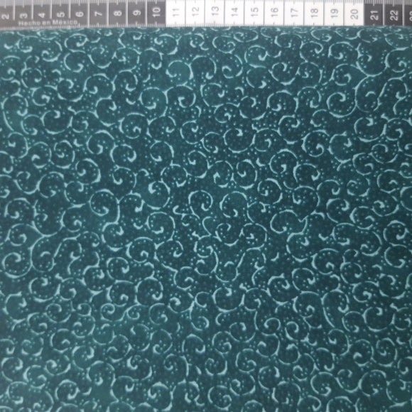 Patchwork stof,  mørk grøn med lyse turkis svirvler.