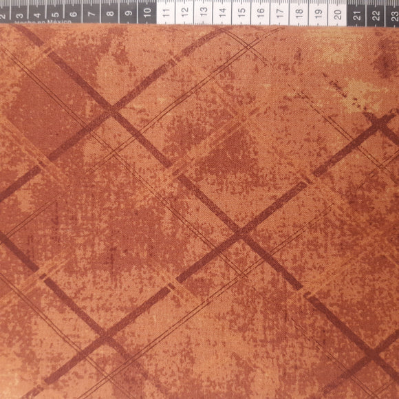 Patchwork stof, rød/brun meleret med skrå streger.