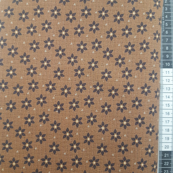 Patchwork stof, brun med små blomster.