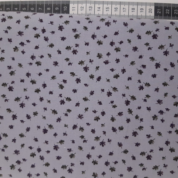 Patchwork stof, lys lilla med små blade.