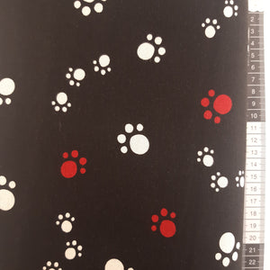 Patchwork stof, kanvas type, sort bund med fod aftryk fra dyr