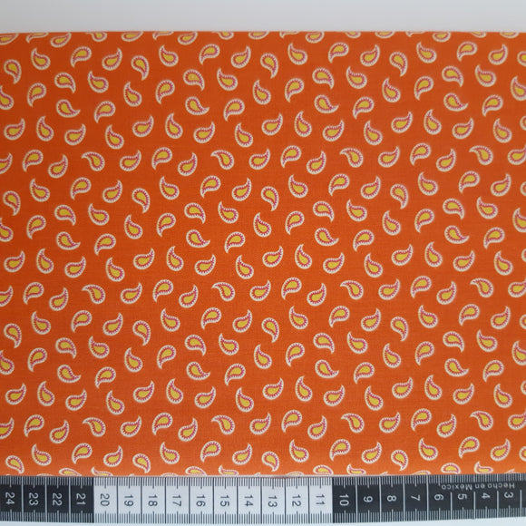 Patchwork stof, orange med gul sjals mønster