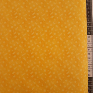 Patchwork varm gul med små geometriske figurer