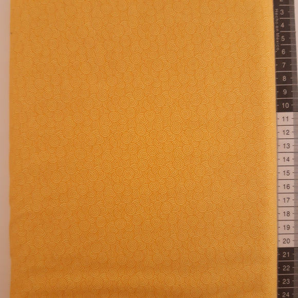 Patchwork stof, varm gul med med lysere små snirkler