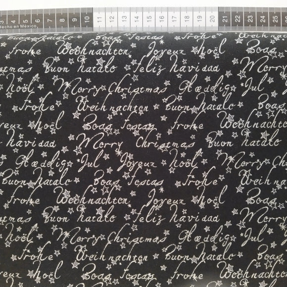 Patchwork stof, sort bund med sølv tekst og små sølv stjerner.