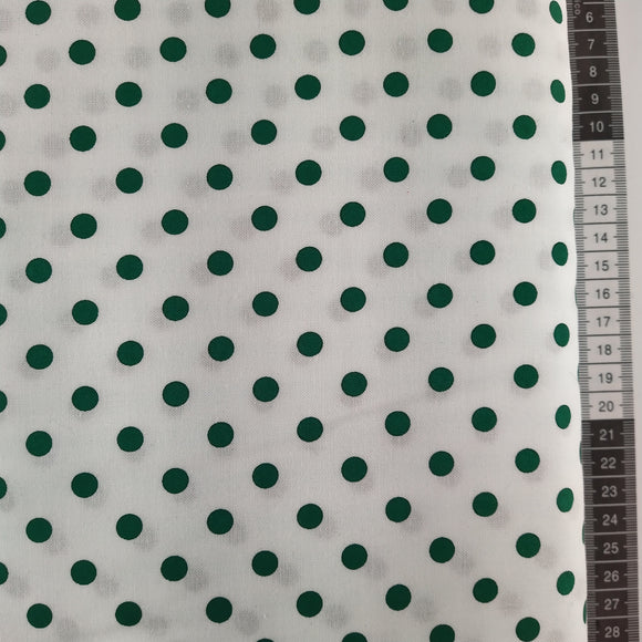 Patchwork stof, hvid bund med små mørke- grønne prikker med glimmer