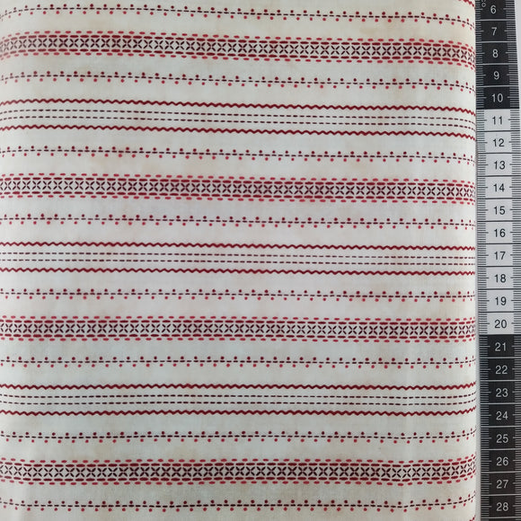 Patchwork stof, råhvid bund med røde  lige og bølgende streger og små prikker i et småt mønstret.