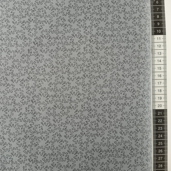 Patchwork stof, grå bund med småt mønstret i sort.
