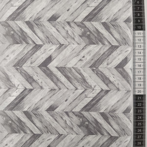 Patchwork stof, grå mønstret med grålige og hvide farver i minder om slidebens gulv.