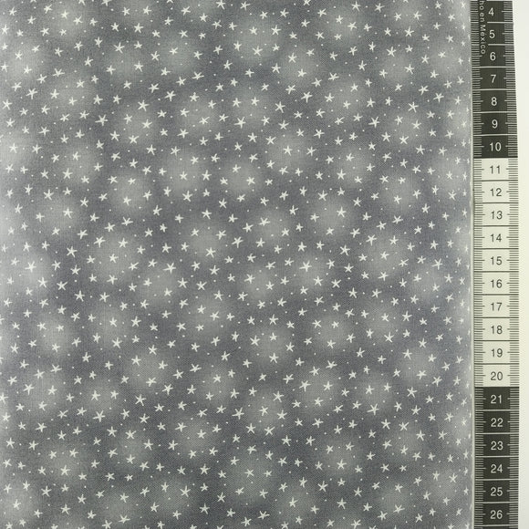 Patchwork stof, grå meleret bund med små enkelt hvide stjerner.