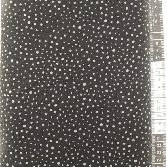 Patchwork stof, sort bund med små forskellige størrelse grå prikker.