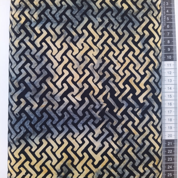 Patchwork stof, sort bund med stort mønstret i gul og grå nuancer