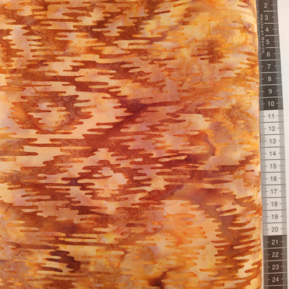 Patchwork stof, orange, beige, brun meleret så det ligner et flot stykke bark .