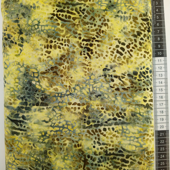 Patchwork stof, lys gul/grøn med oliven mønster der ligner et dyreprint.