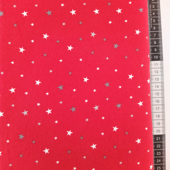 Jersey Stof, rød bund med små stjerner160cm bred. Lækker kvalitet