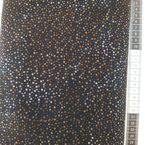 Patchwork stof, sort med brunlige små splash prikker.
